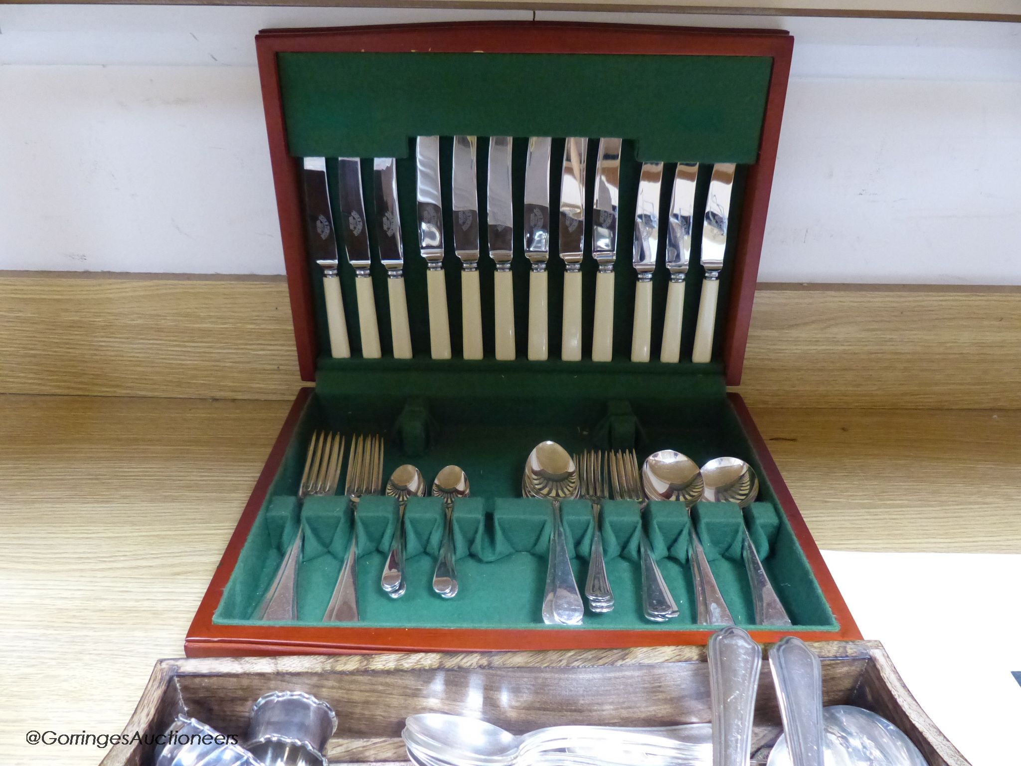 Five Italian 800 standard tea spoons, and six dessert spoons, a silver napkin ring, an 800 standard pill box and a quantity of plated cutlery.